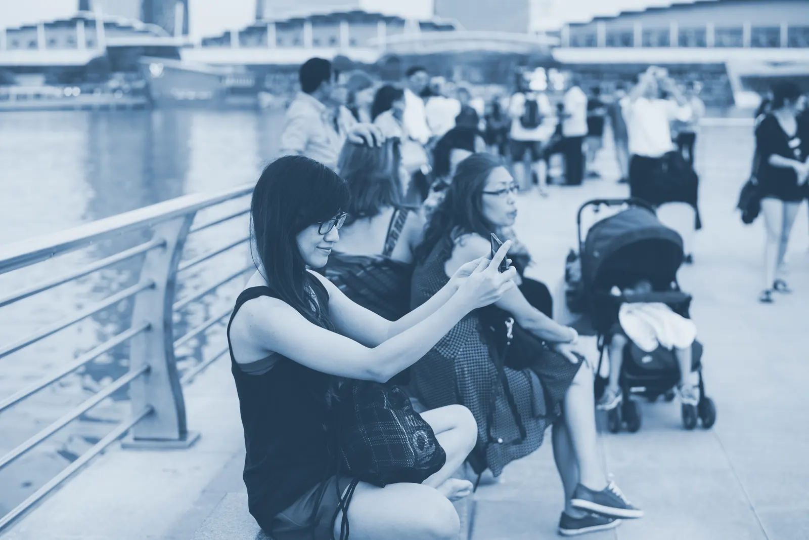 A person holding a phone at arm's length to photograph themselves.